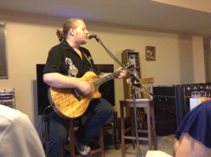 Trevor at the house concert